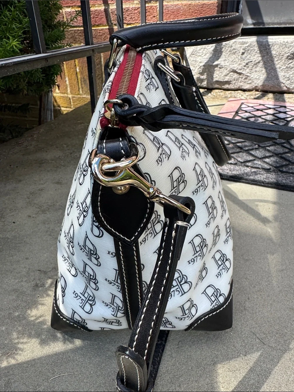 DOONEY AND BOURKE BLACK AND WHITE 1975 LOGO SATCHEL BAG